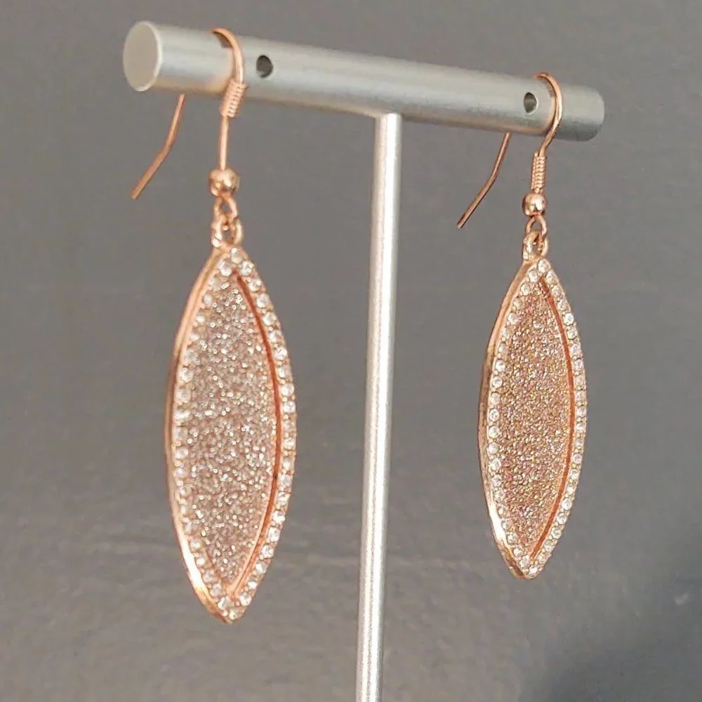 Sparkly rose gold dangle earrings with cz accents